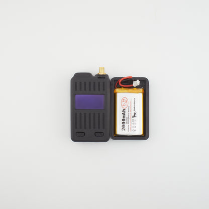 Black electronic device with a battery compartment on a light gray background WisMesh Board ONE minibox